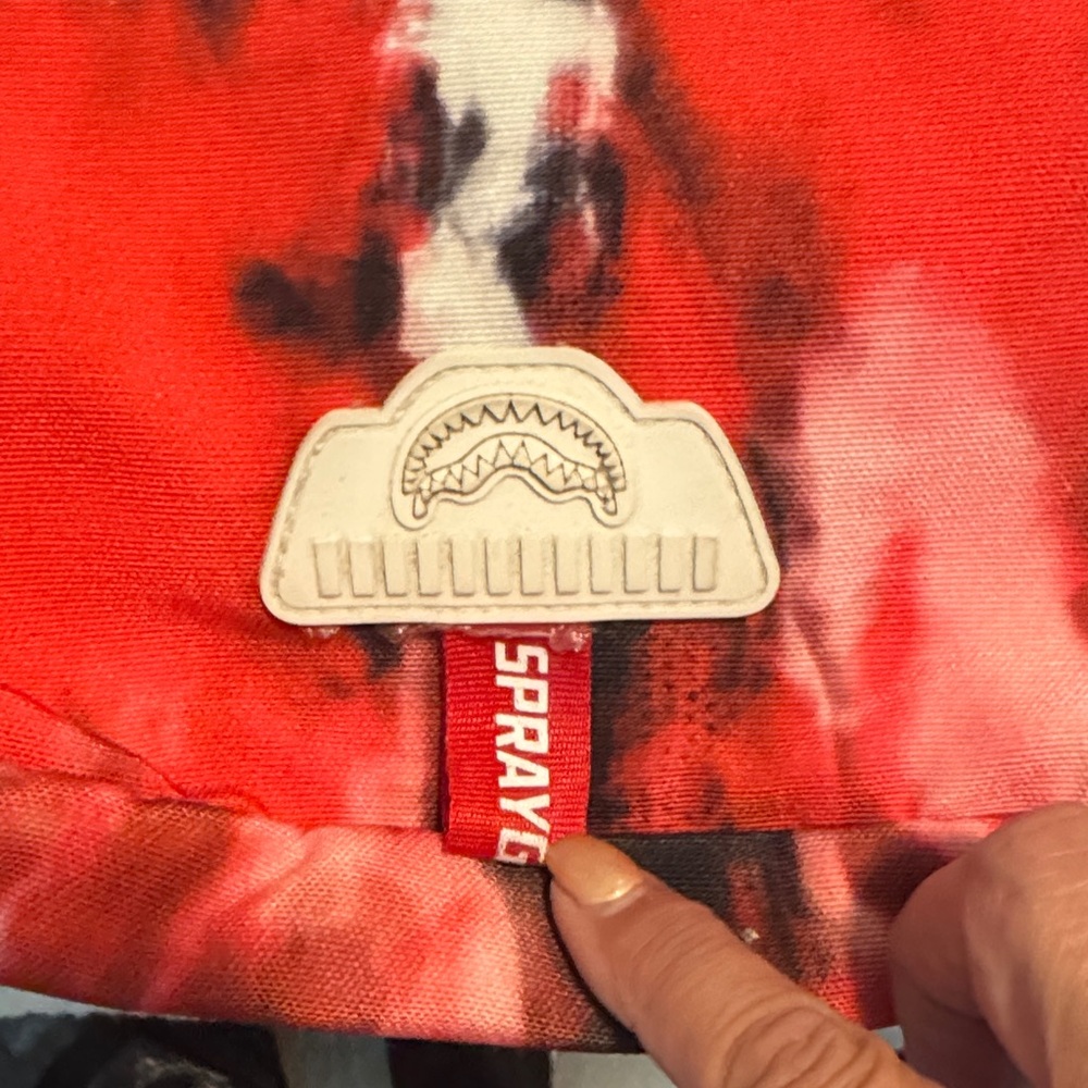 Sprayground Red and Black Tie-Dye Backpack with White Symbol - Picture 2 of 12
